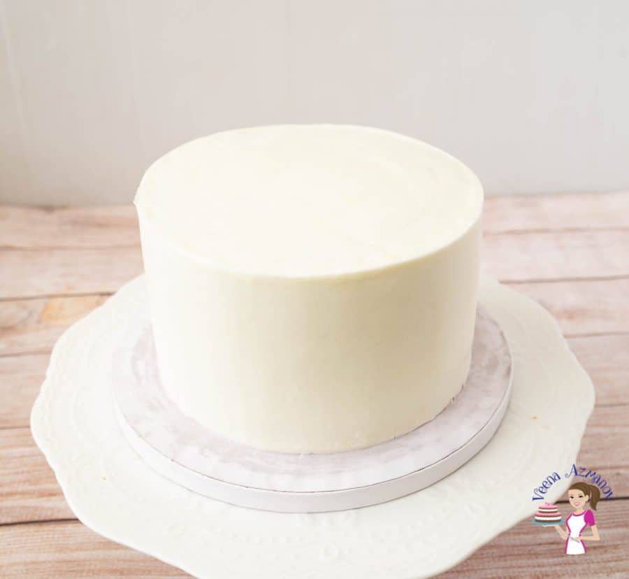 A frosted cake with sharp edges.