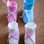 Baby booties made from sugar paste.