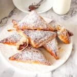 Puff pastry filled with nutella dusted with powdered sugar.