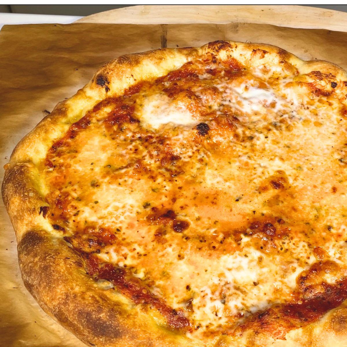 Fresh baked pizza dough on the table.
