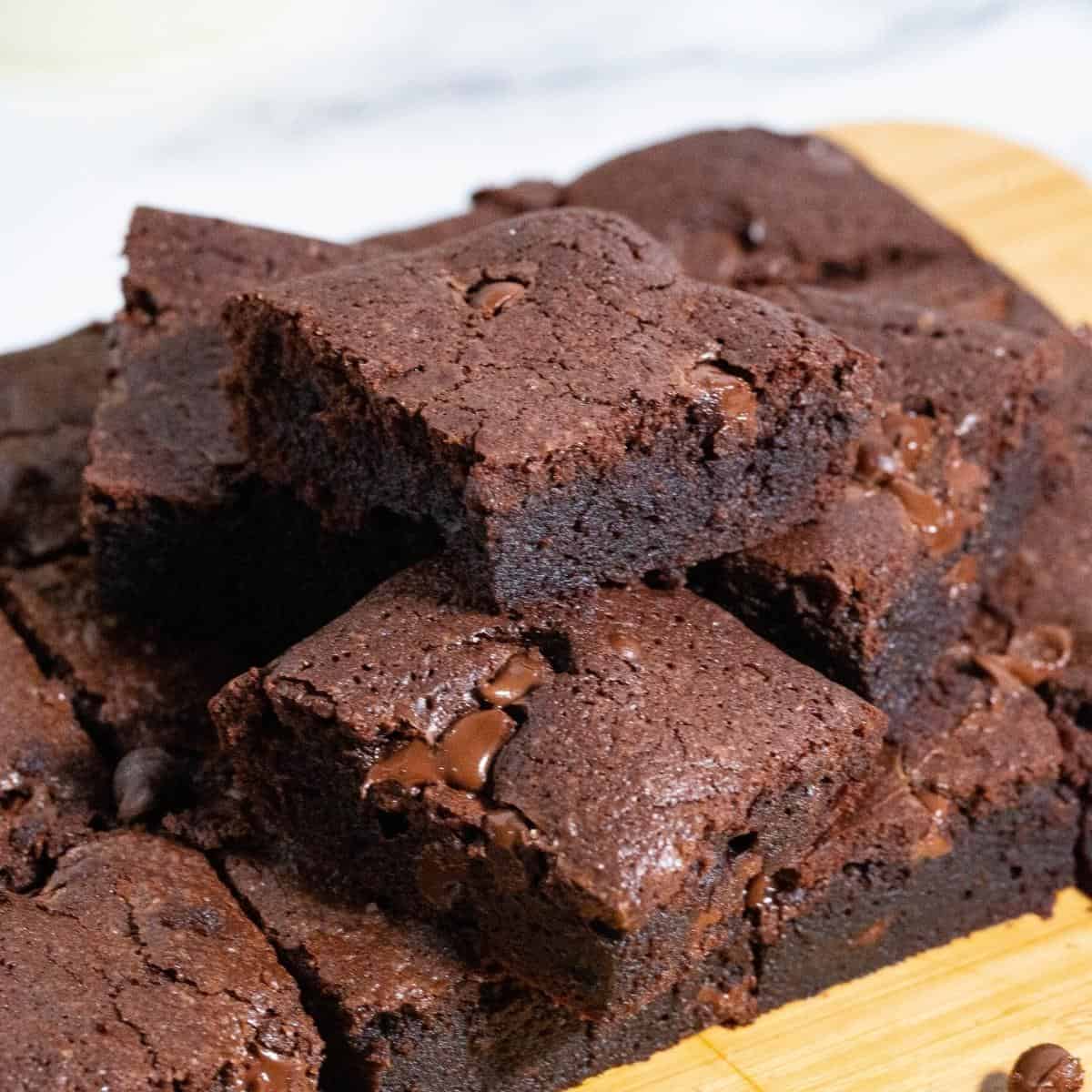 Brownie squares on a wooden board.