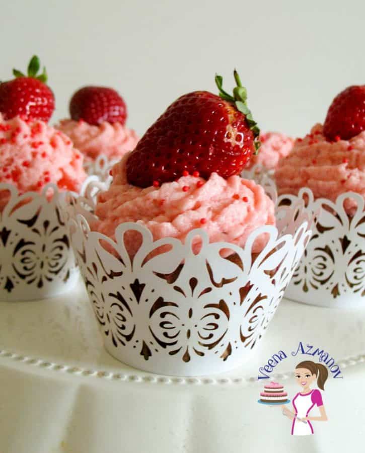 These delicious Strawberry Cupcakes are the ultimate strawberry pleasure with soft jam centers, frosted with luxurious strawberry buttercream and adorned with a fresh strawberry. These are simple, easy and my one bowl baking from scratch series you will love These delicious Strawberry Cupcakes are the ultimate strawberry pleasure with soft jam centers, frosted with luxurious strawberry buttercream and adorned with a fresh strawberry. These are simple, easy and my one bowl baking from scratch series you will love