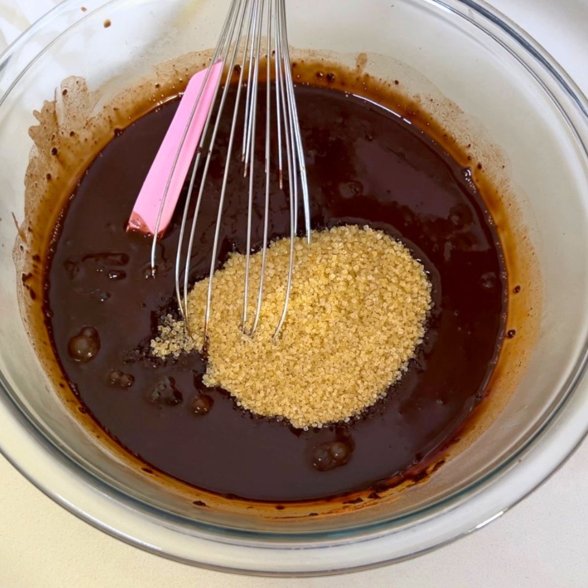 Add the white and brown sugar to the chocolate cake.