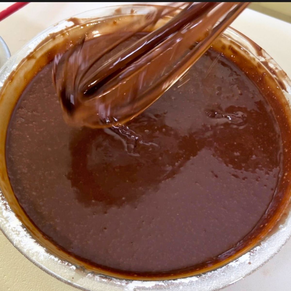 A one bowl chocolate cake in the pan.