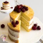 A slice of a naked vanilla cake on a cake stand.