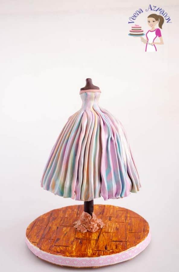 A cake designed like a dress on a mannequin.
