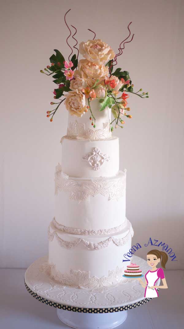 A decorated wedding cake with sugar flowers.