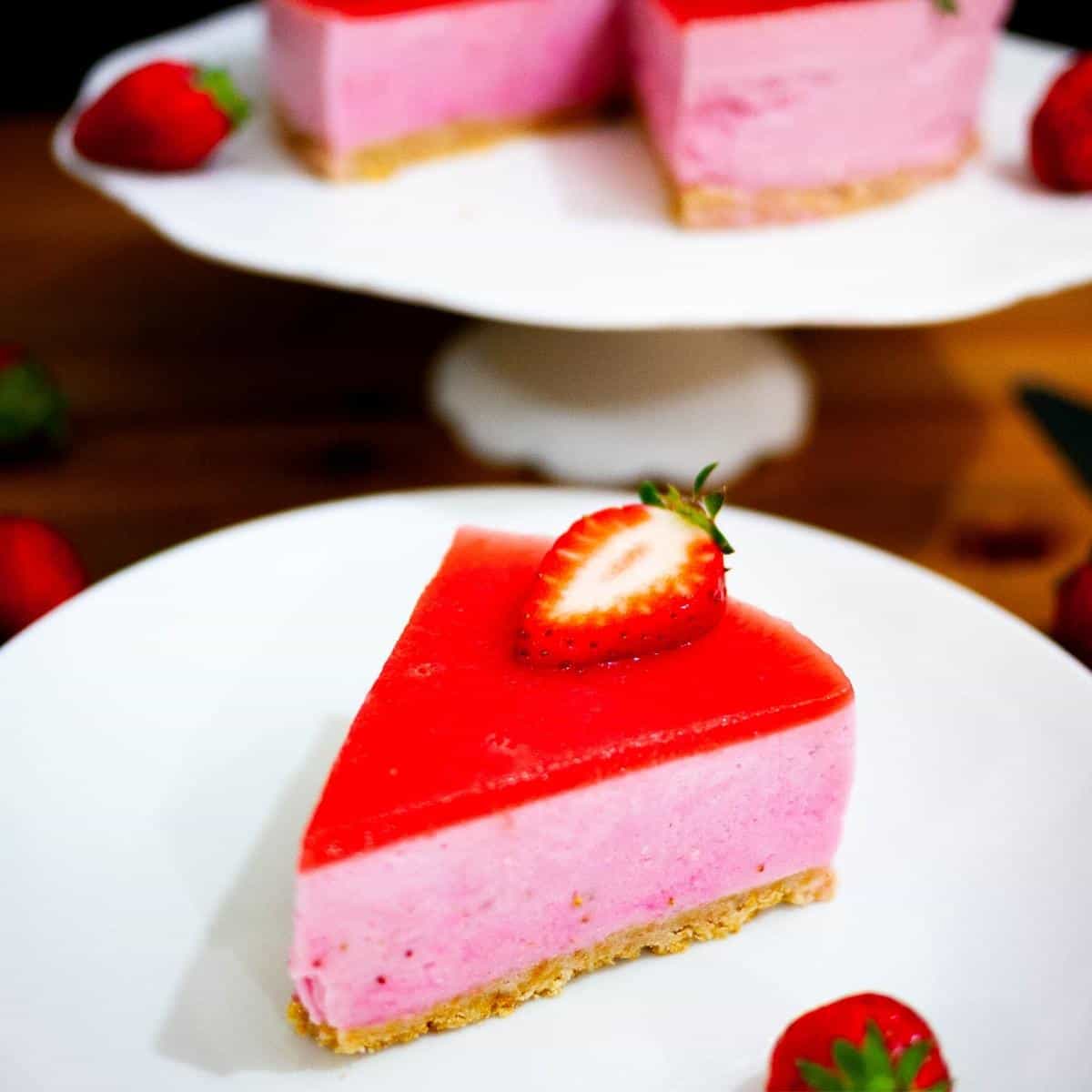 A slice of Bavarian Cream Cake with strawberry jello.