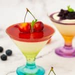 A ice cream glass with cream Bavarian and strawberry sauce.