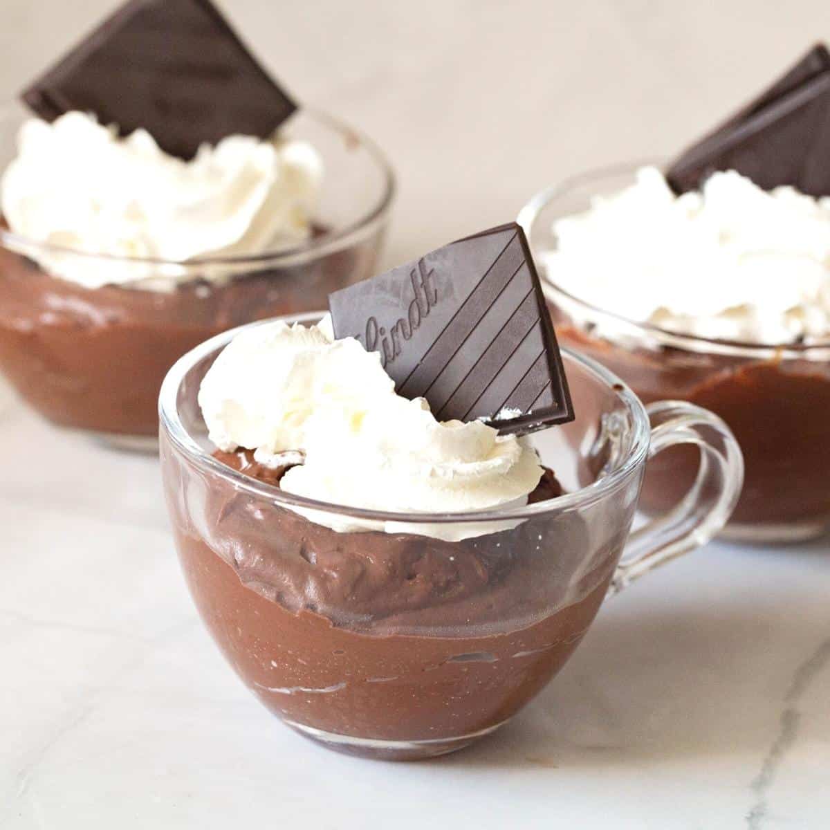 A dessert cup with chocolate pudding.