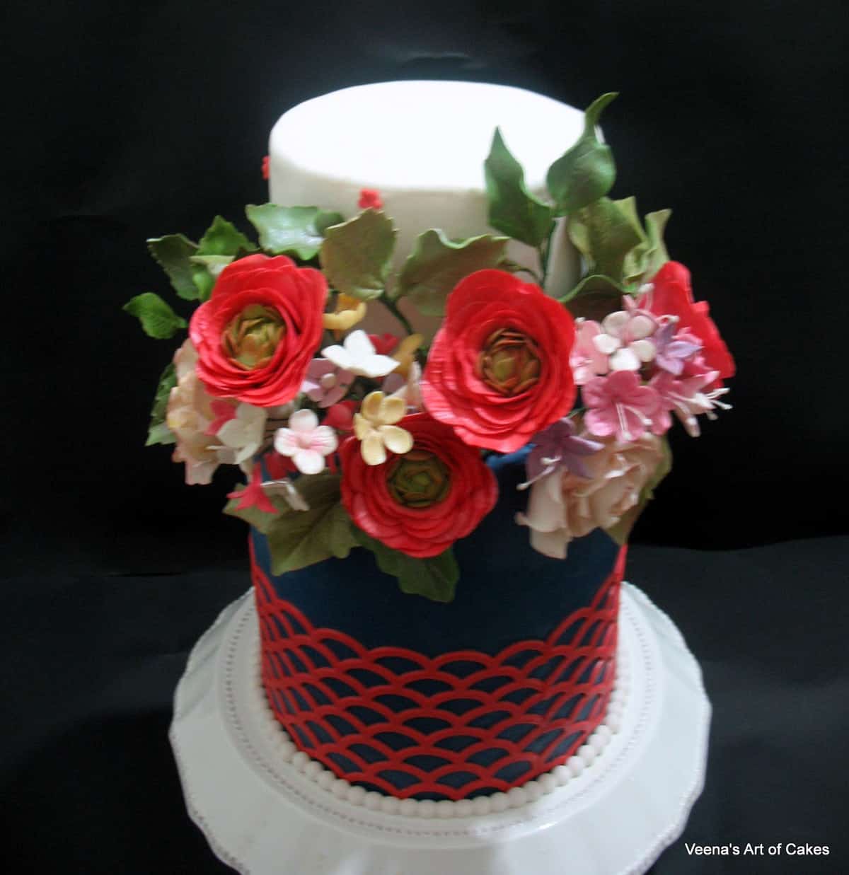 A decorated cake with sugar flowers.