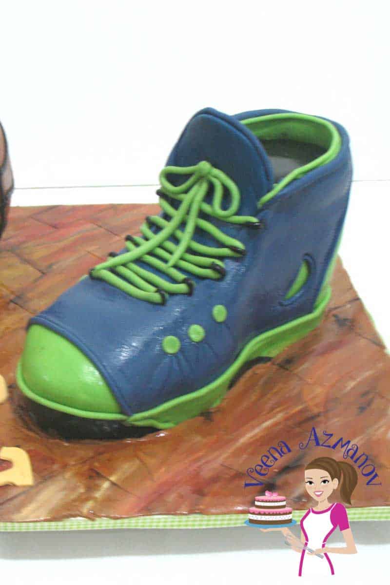 A cake decorated like a basketball and a shoe.