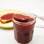 A jar and spoon with jar.