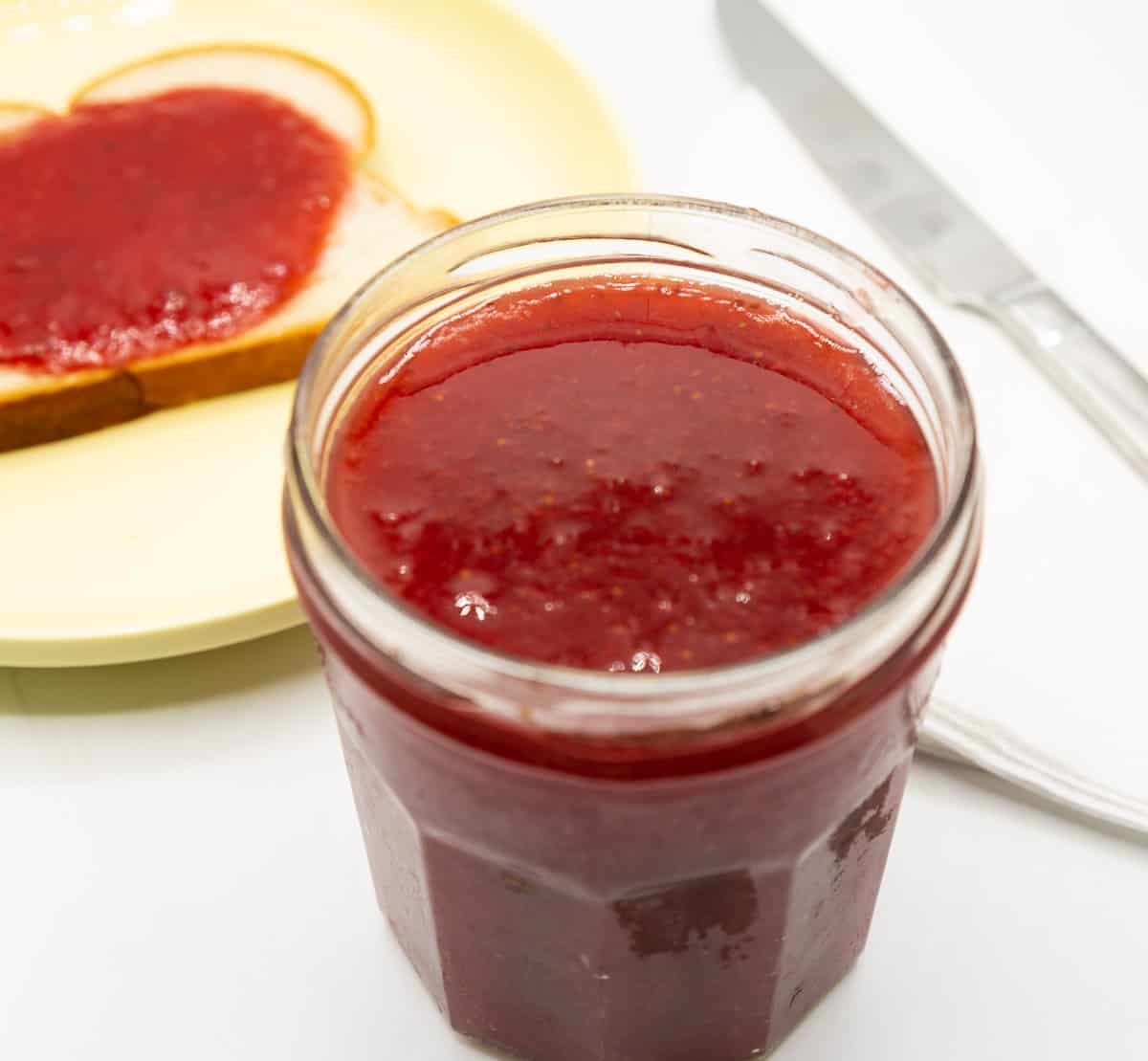 Strawberry jam in a jam jar.
