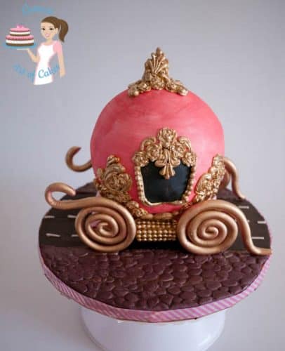 A cake decorated to look like Cinderella\'s carriage.