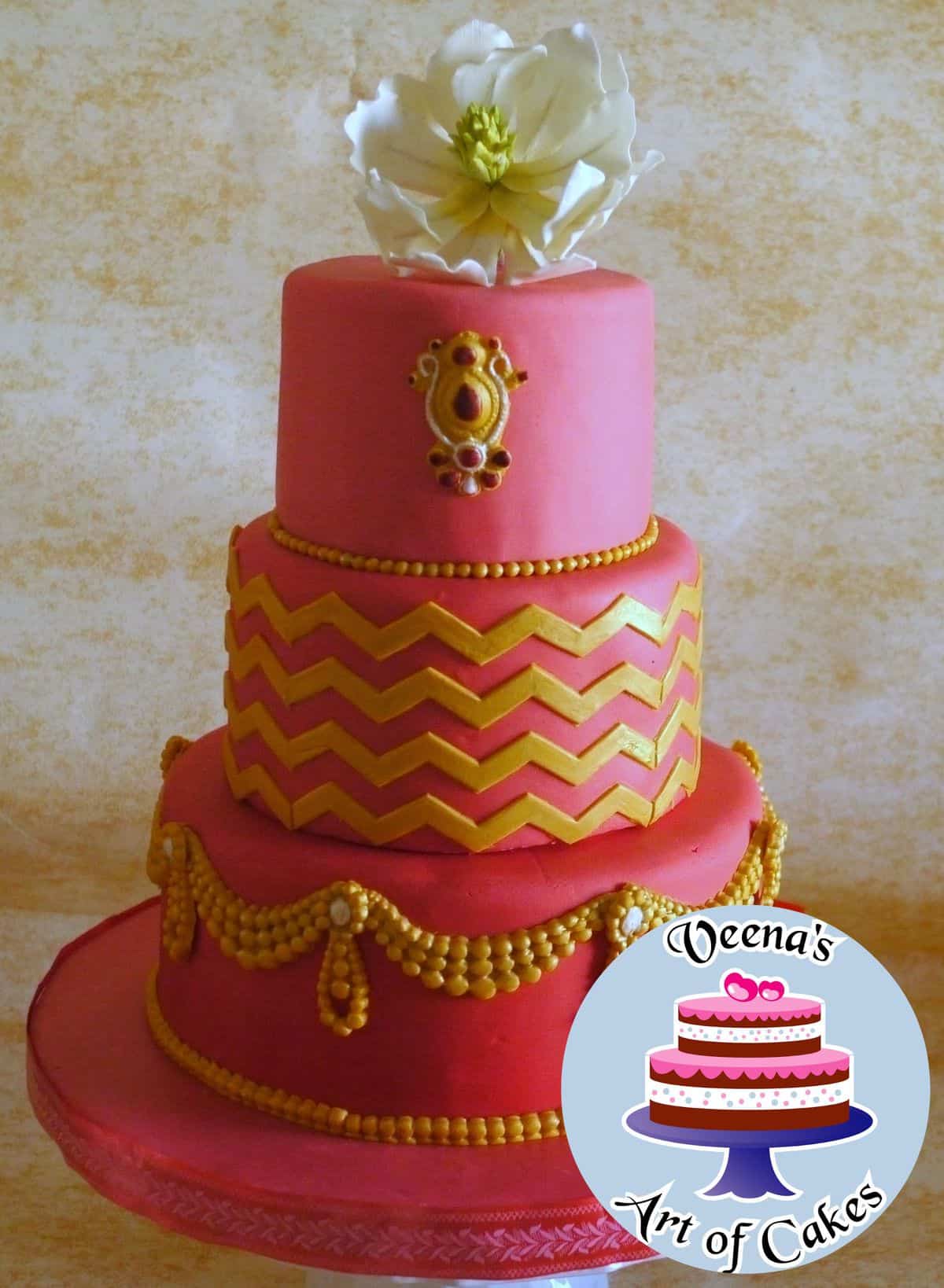 A red ombre swag decorated cake.