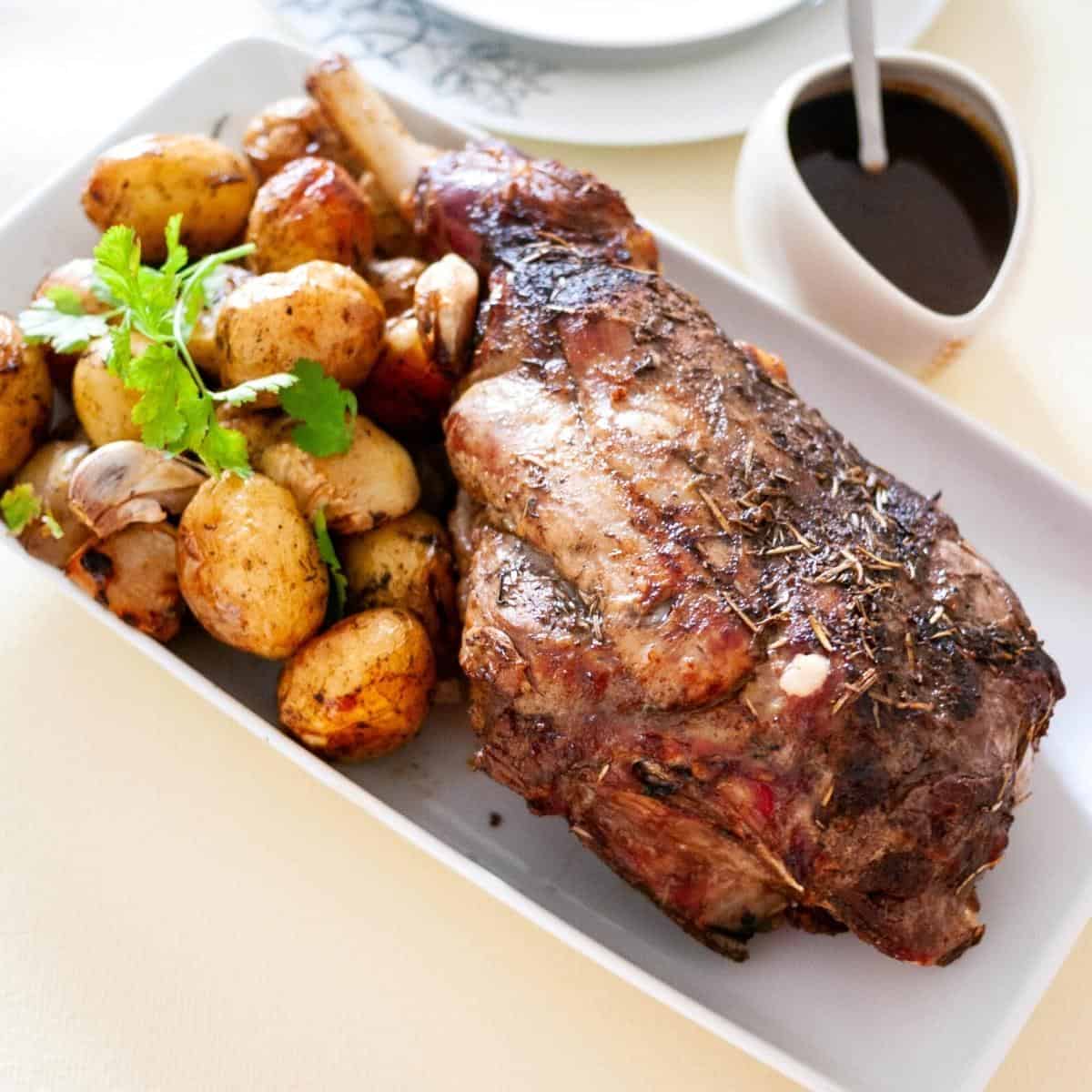 A platter with roasted baby potatoes with lamb.