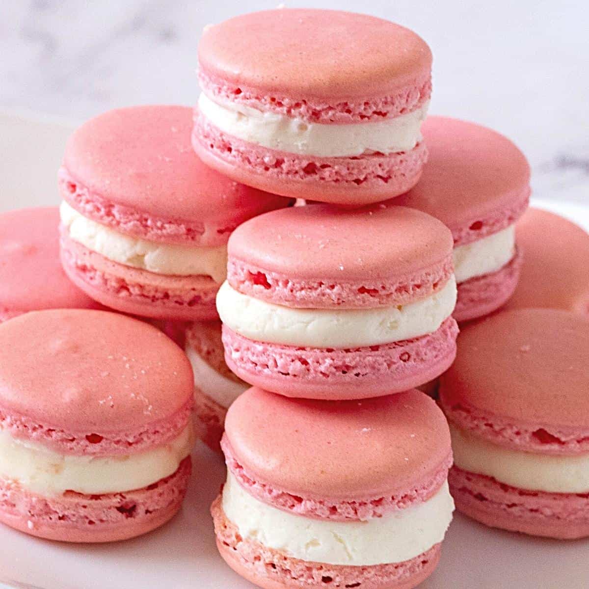 A stack of Pink colored French Macarons.