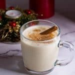 A glass with Christmas eggnog.