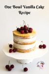 A Pinterest optimized image for one bowl vanilla cake recipe featuring a three layer vanilla cake frosted with American Buttercream and topped with fresh cherries
