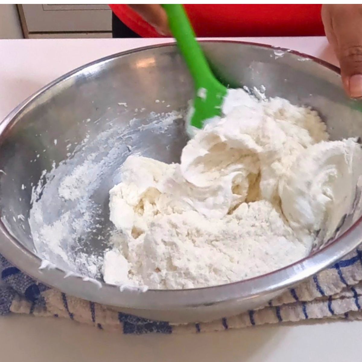 Making the macronage for French macarons.