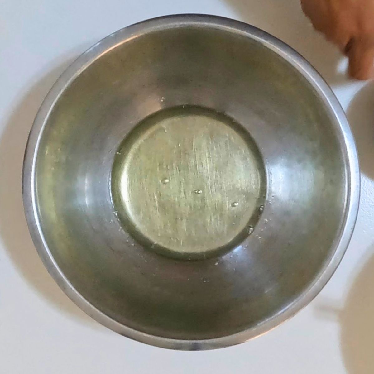 Strained egg whites in the bowl for meringue.