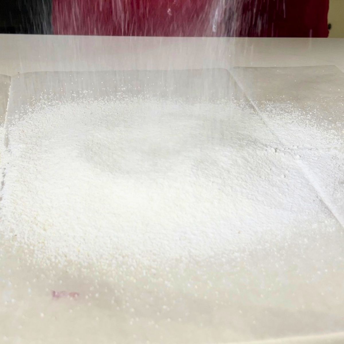 Sifting the almond and powdered sugar for macarons.