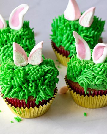 Cupcakes with frosted bunny ears.