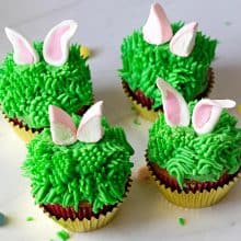 Grass frosted cupcakes with marshmallow bunny ears.