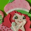 An image of a girl made with fondant.