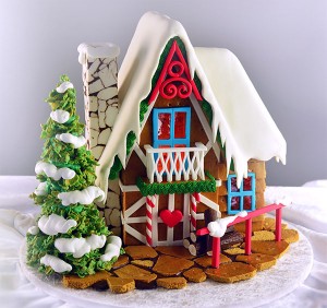 A cake decorated to look like a gingerbread house.