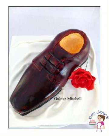 A cake decorated to look like a man's shoe.