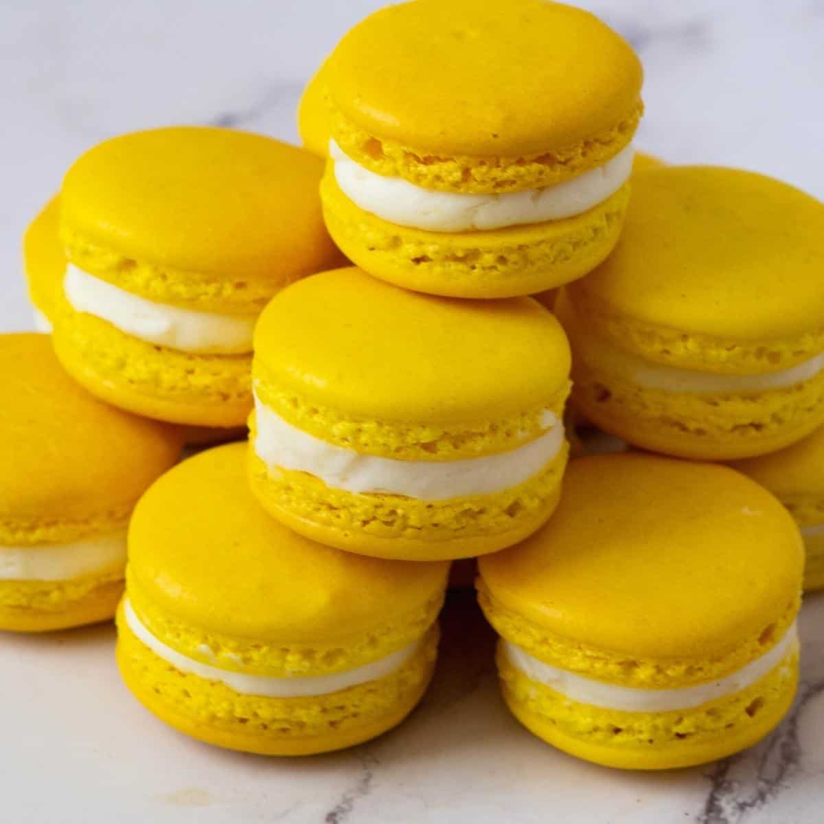 Stacked yellow French macarons.