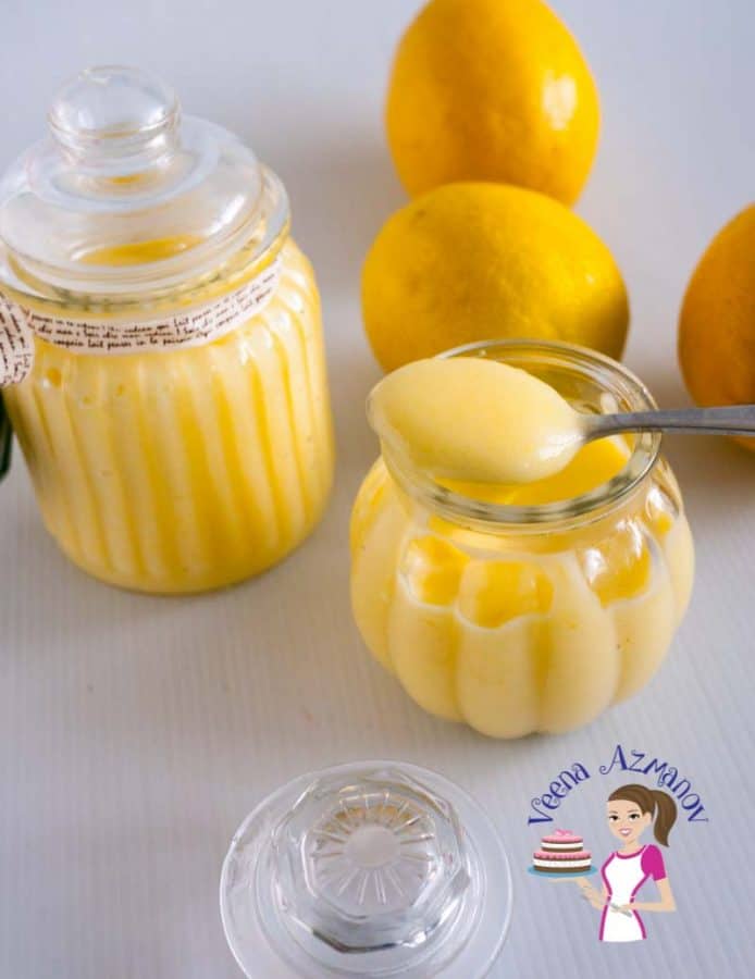 A jar of lemon curd on a table.