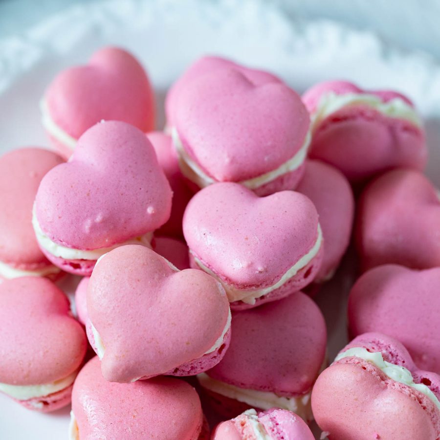Stack of heart macarons on the table.