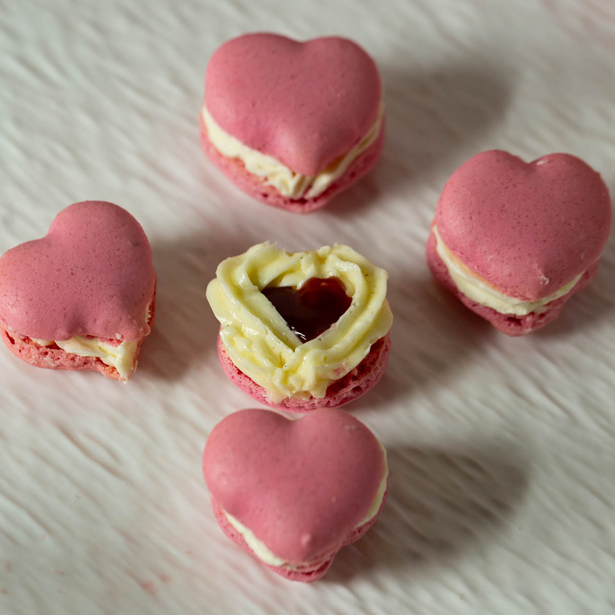 Heart macarons on the table.