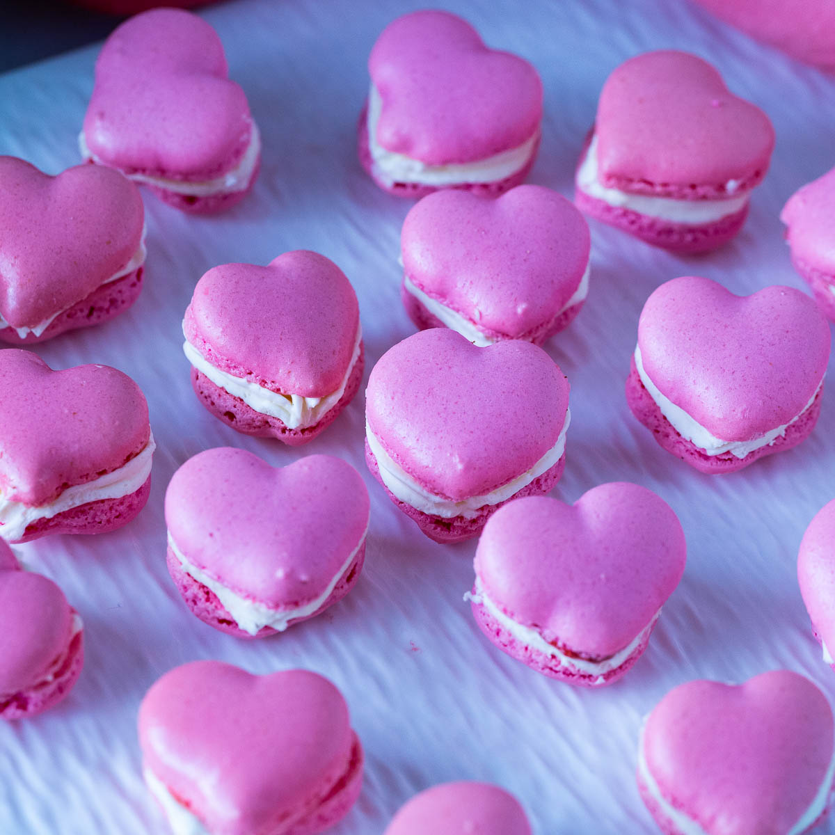 Collection of heart macarons on the table.