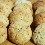 A wooden board with cookies.