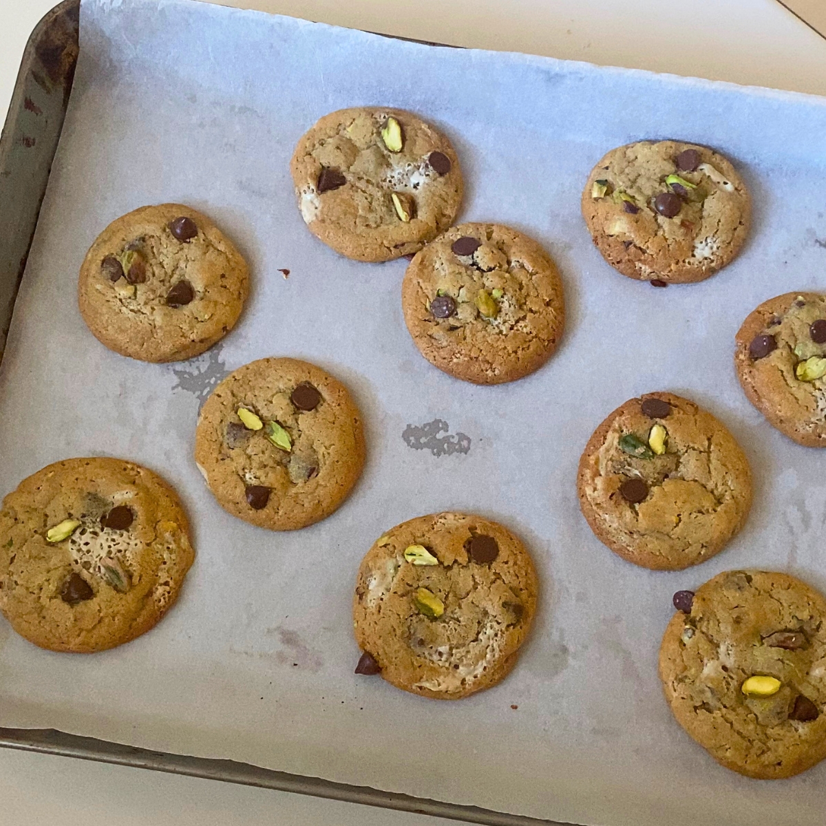 A baking tray with fresh baked halva cookies.