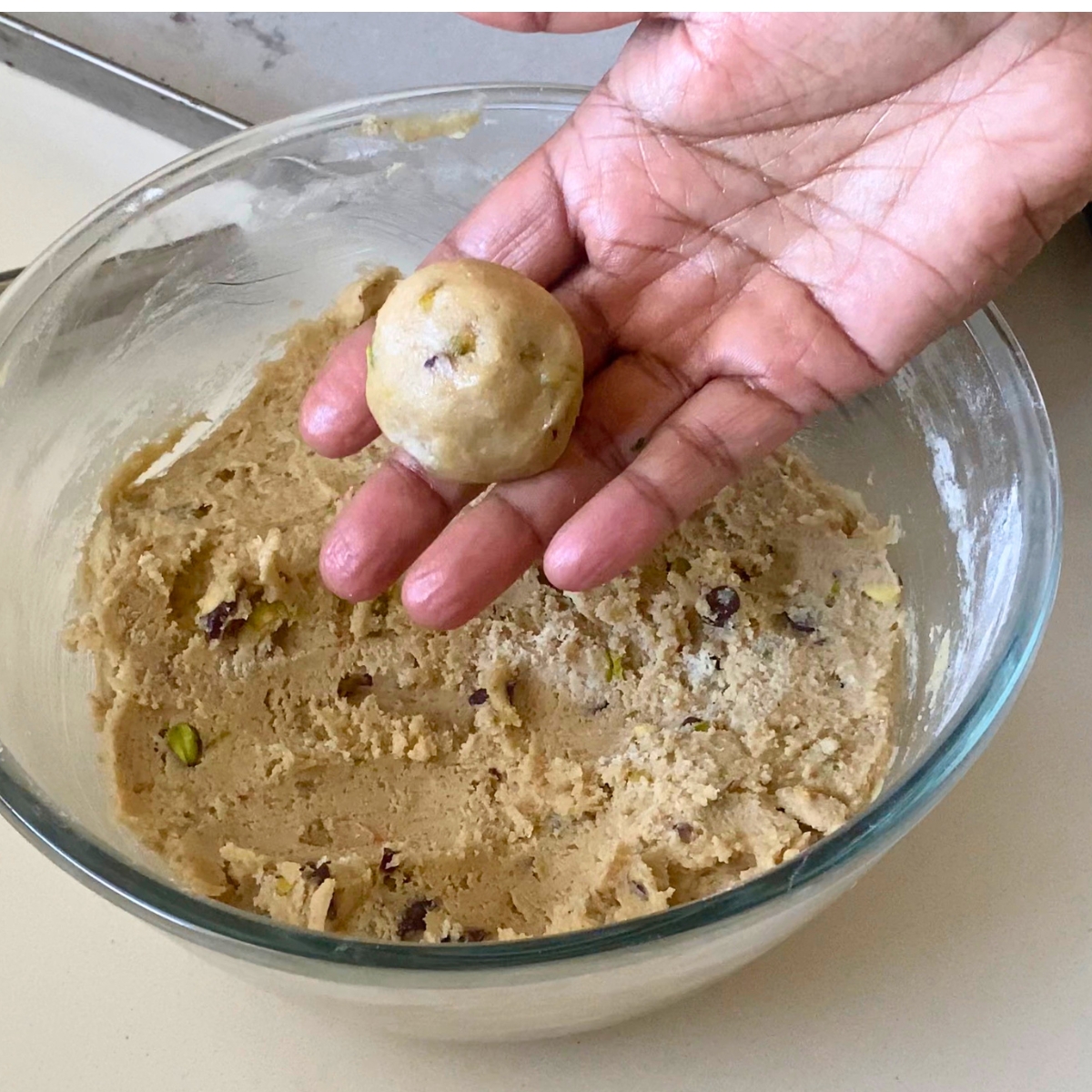 A bowl with fresh halva cookie dough balls.