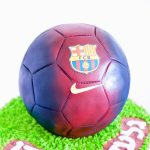 A cake decorated to look like a Barcelona football.