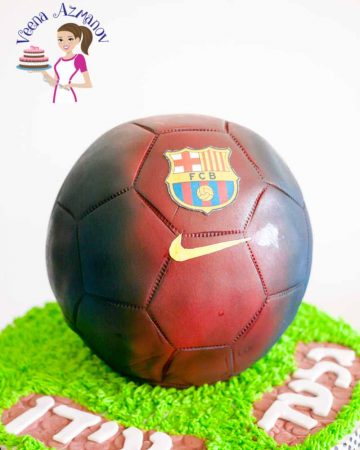 A cake decorated to look like a Barcelona football.