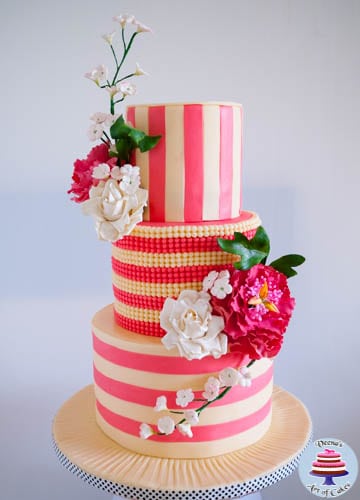 An ivory and rose pink wedding cake.
