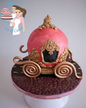 A cake decorated to look like Cinderella's carriage.