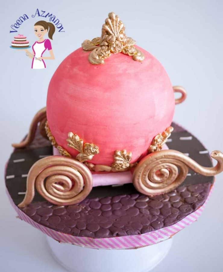 Progress photos of making a cake decorated to look like Cinderella\'s carriage.