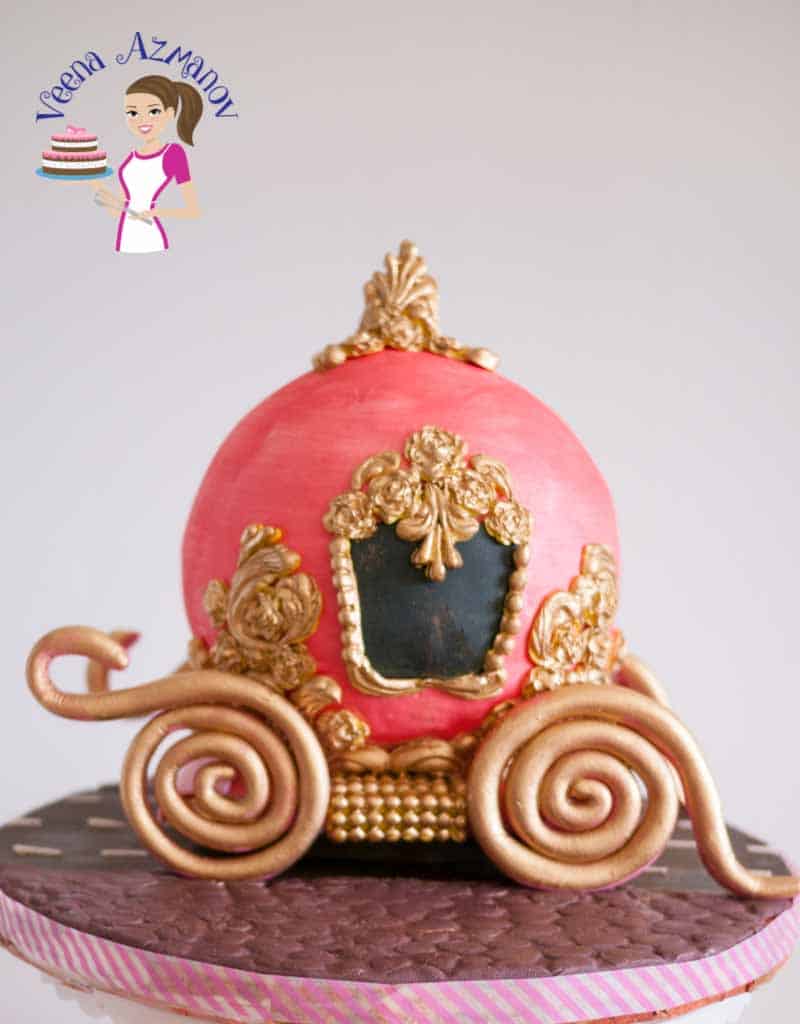 A cake decorated to look like Cinderella's carriage.