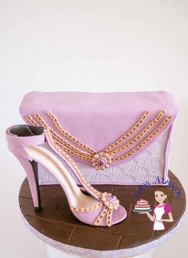 A cake decorated to look like a woman's purse and shoe.