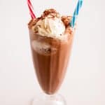 A milkshake glass with frozen hot chocolate