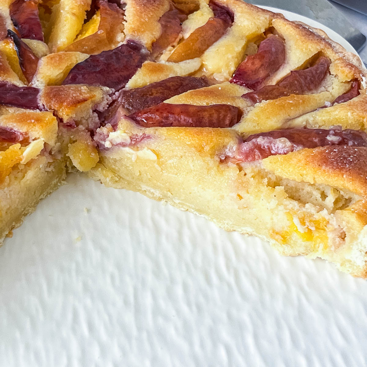 Nectarine tart close up of the baked frangipani filling.