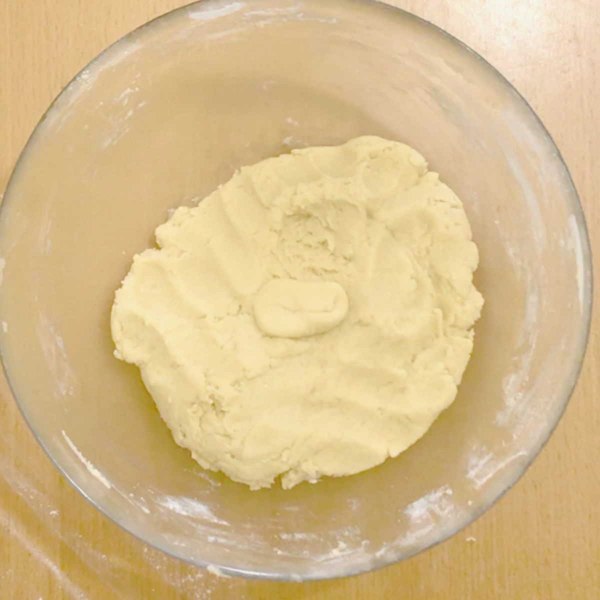 A bowl preparing shortcrust pastry.